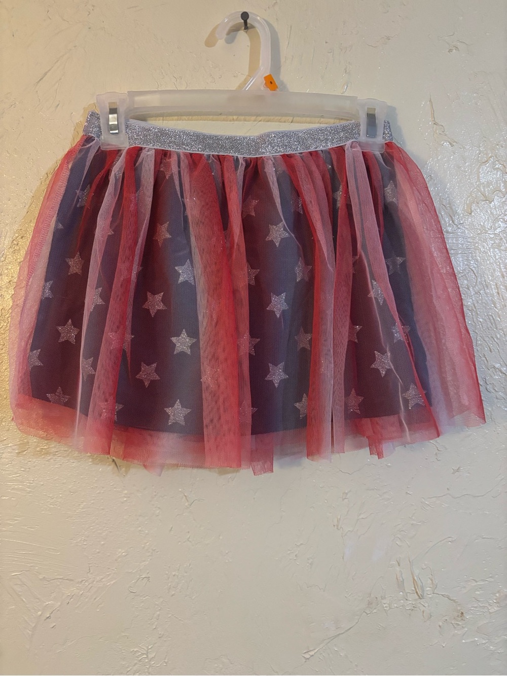 Girls Star Tulle Skirt in Navy and Red with stars underneath.